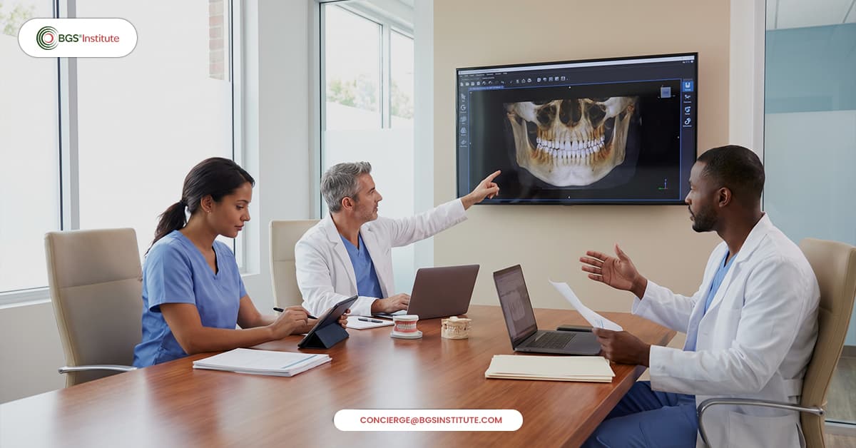 Biological dentistry team discussing a complex case while reviewing a panoramic dental scan