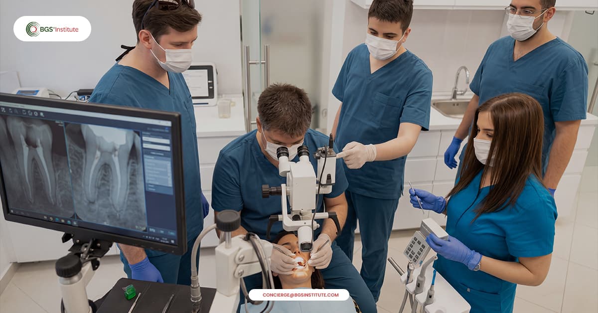 Biological Dentistry hands-on training with dentists performing clinical procedures using microscopes and digital imaging