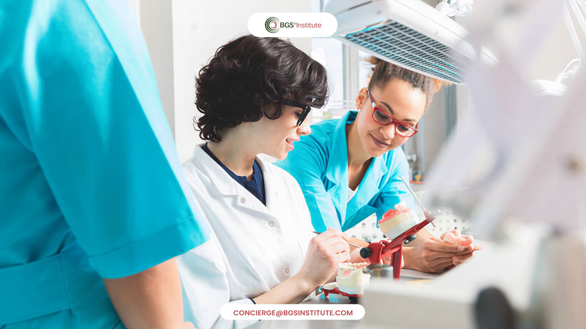 BGS Institute dental professionals reviewing dental models during Biological Dentistry training