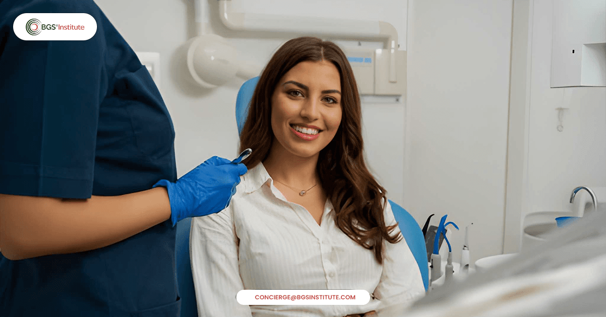 Smiling patient at dental clinic during oral examination showing importance of oral health in chronic disease prevention
